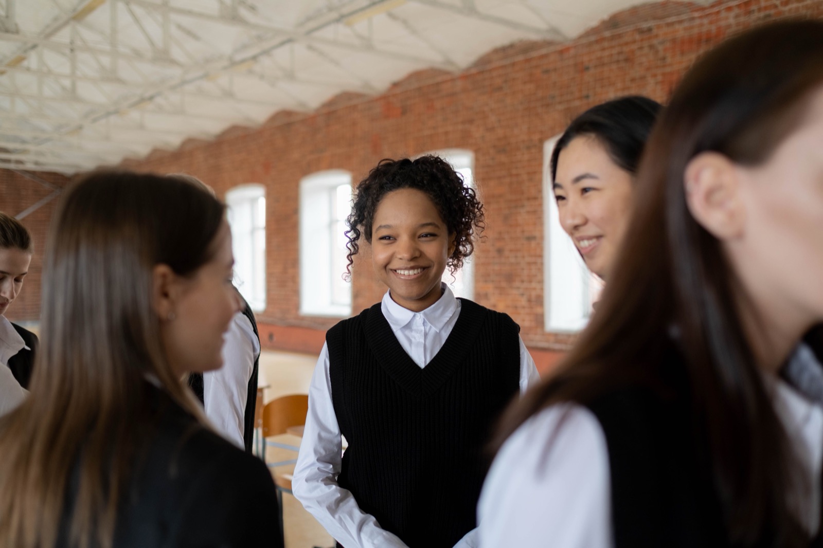 Young people smiling and talking together