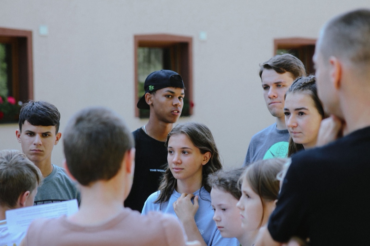 Young people listening and taking part in a group conversation